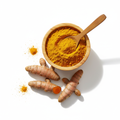 Turmeric powder in a wooden bowl with whole turmeric roots on white background