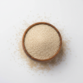 Poppy seeds (khus khus) in a wooden bowl on white background