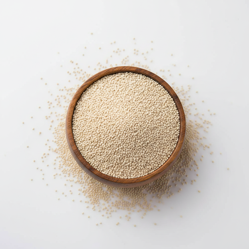 Poppy seeds (khus khus) in a wooden bowl on white background
