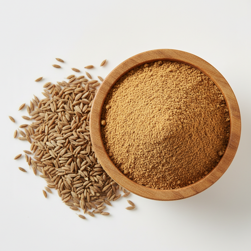 Cumin powder in a wooden bowl with whole cumin seeds on white background